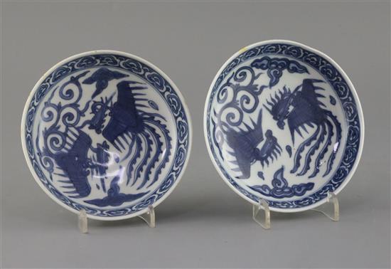 A pair of Chinese Ming blue and white phoenix saucer dishes, pseudo Wanli mark, 17th century, D. 13.5cm